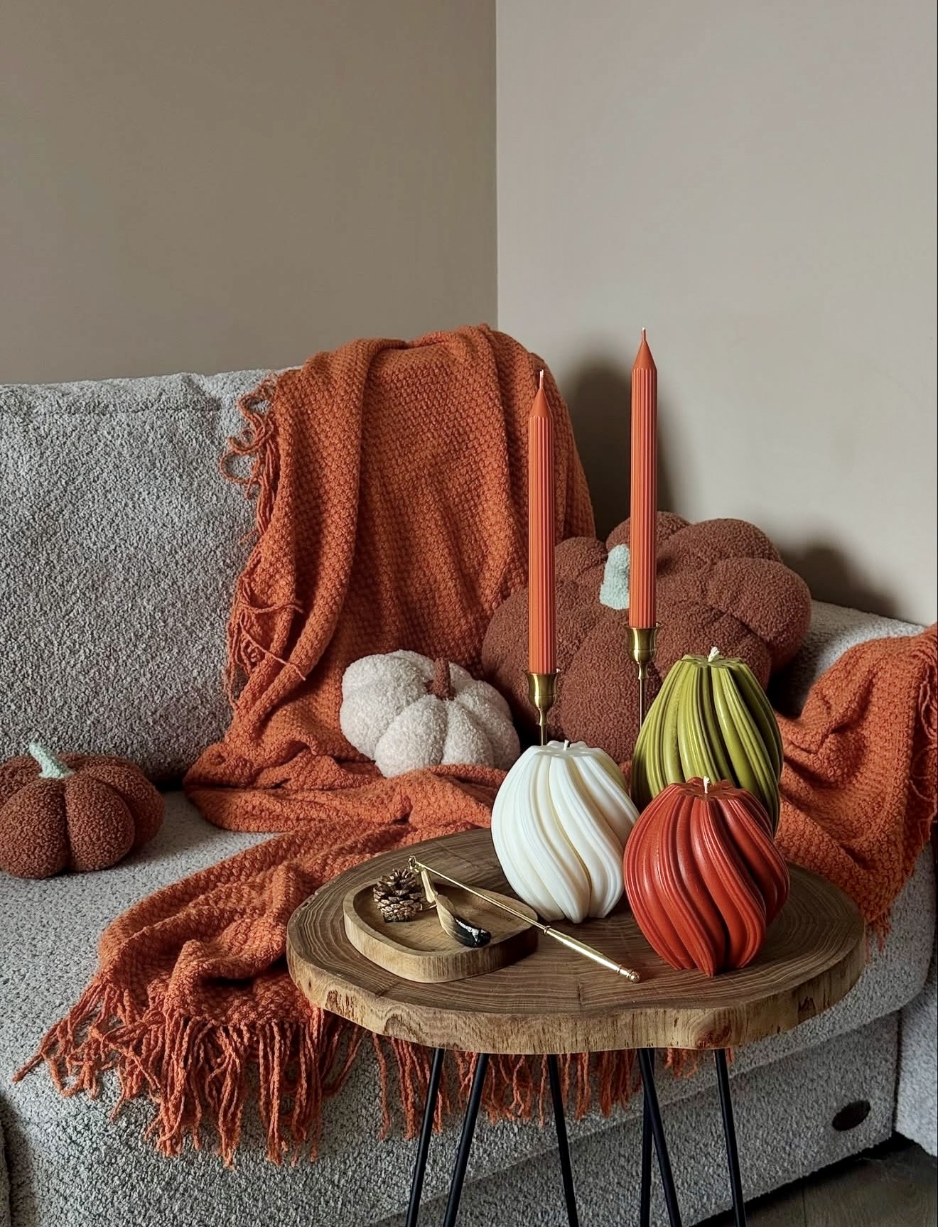 Cozy Autumn Candle Arrangements on Textured Throws