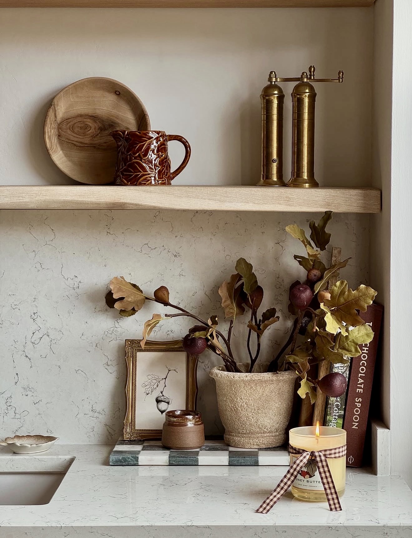 Cozy Autumn Display With Candle And Botanicals
