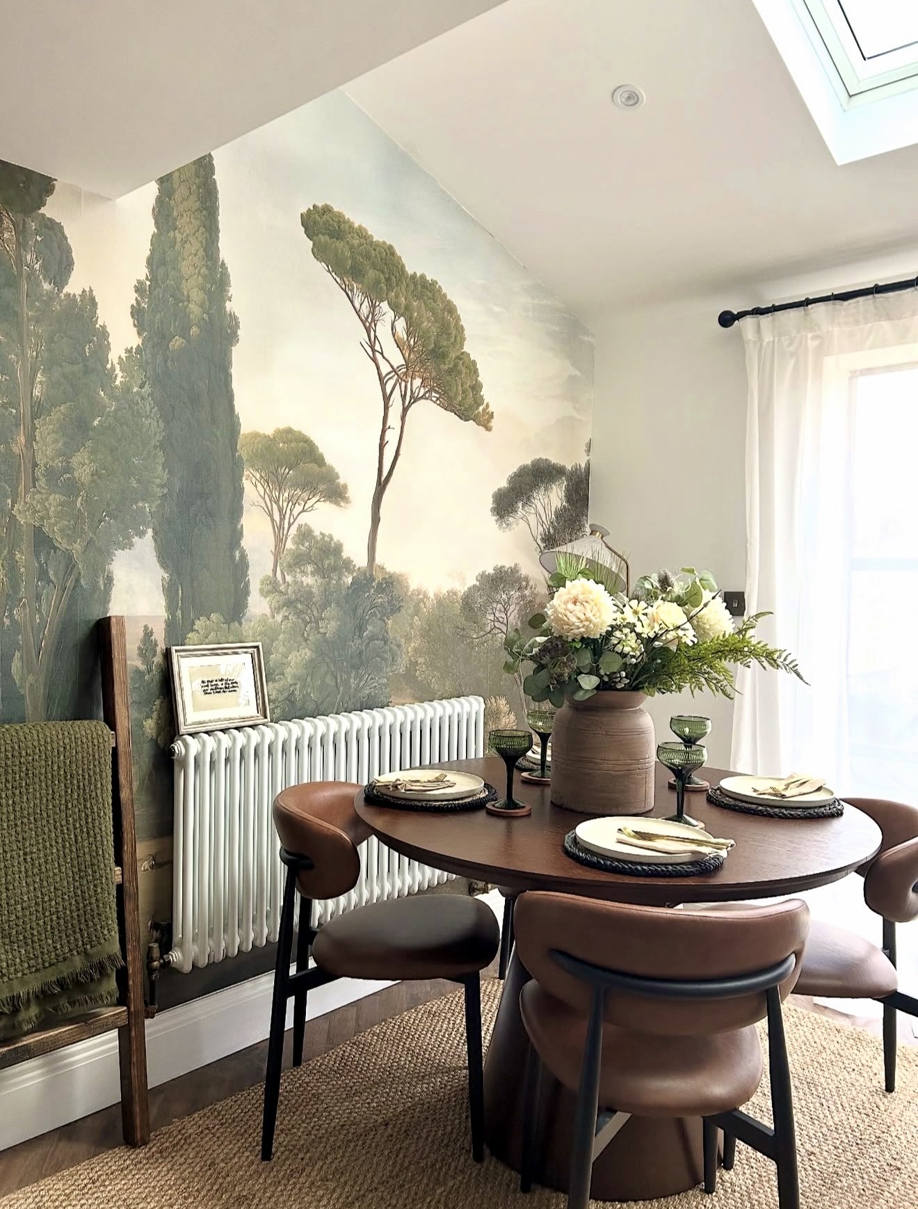 Elegant Oval Dining Room With Mural Wallpaper