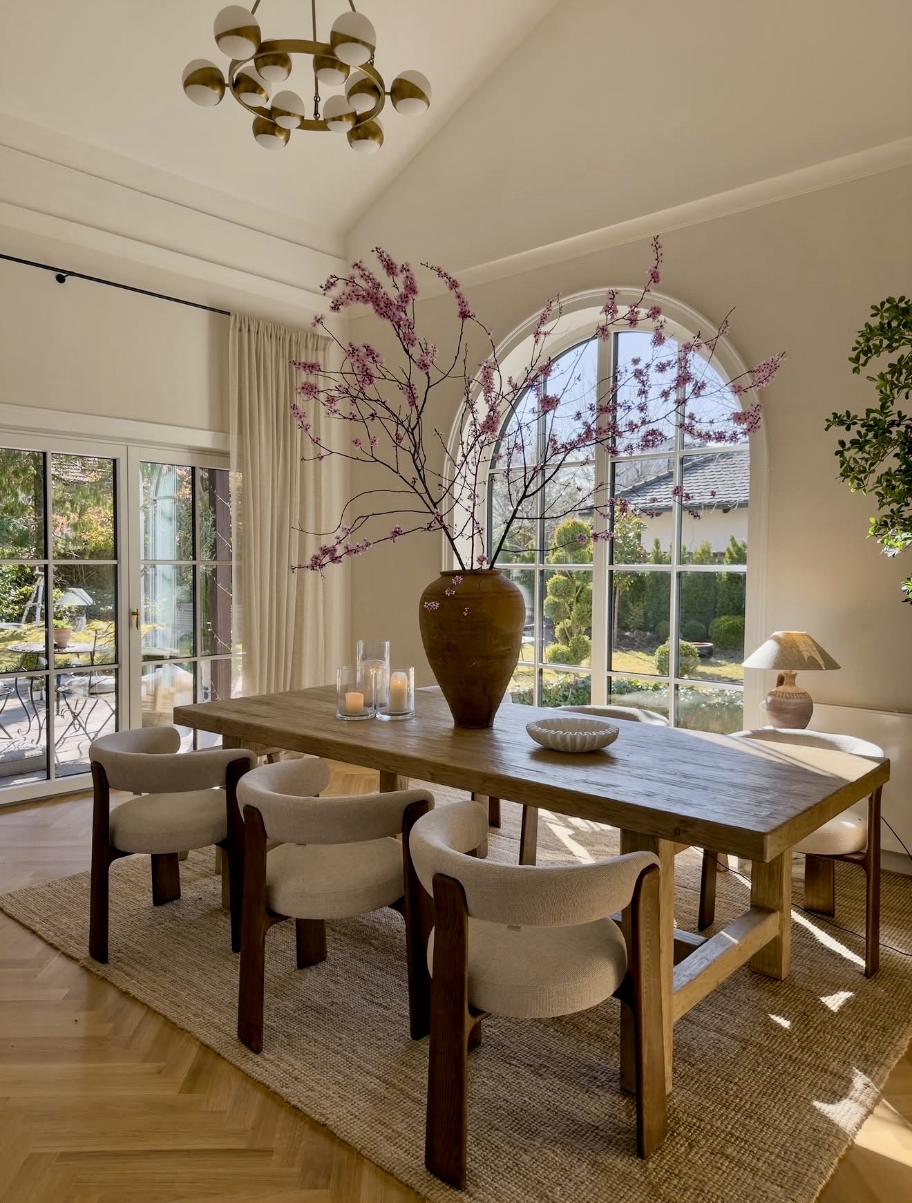 Natural Wood Dining Set With Arched Window View