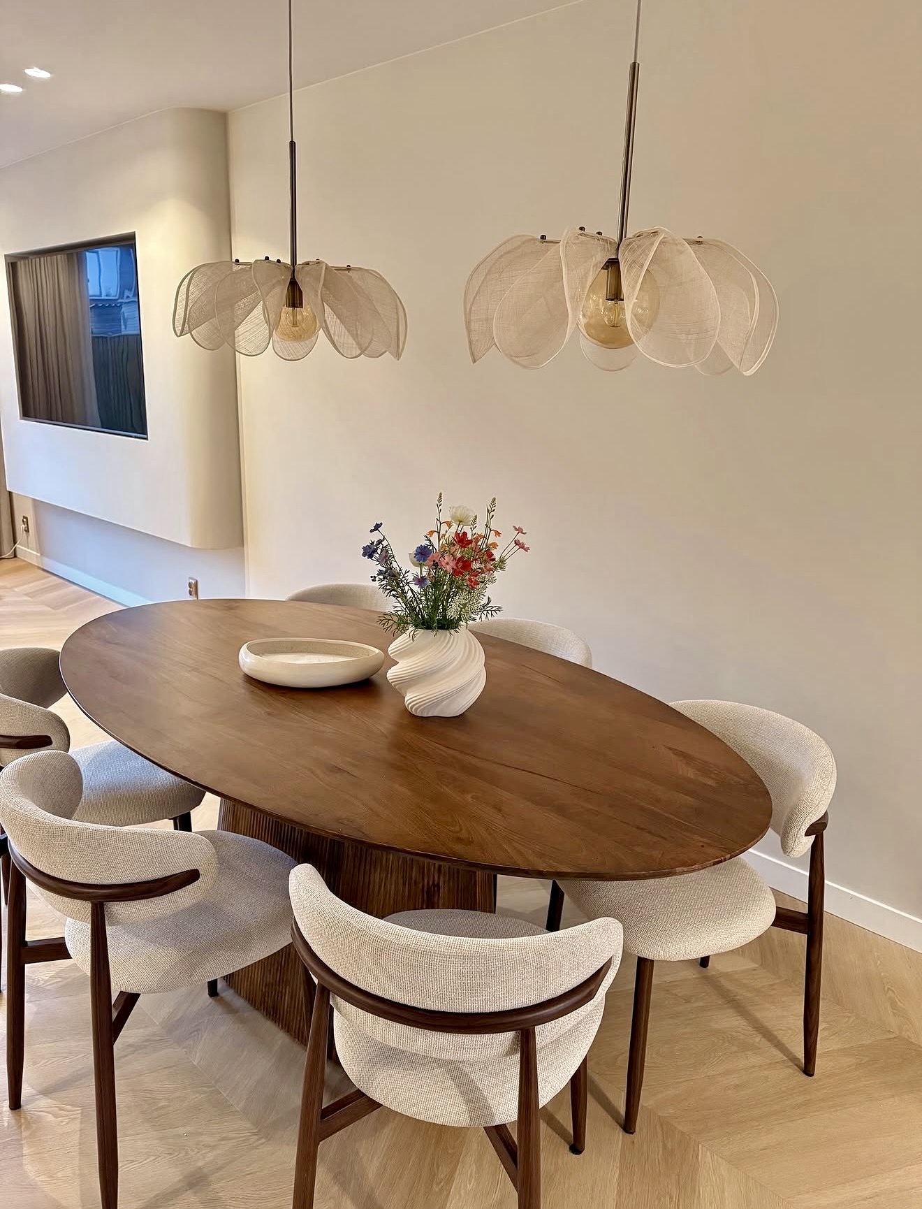 Organic Oval Dining Table with Sculptural Vase