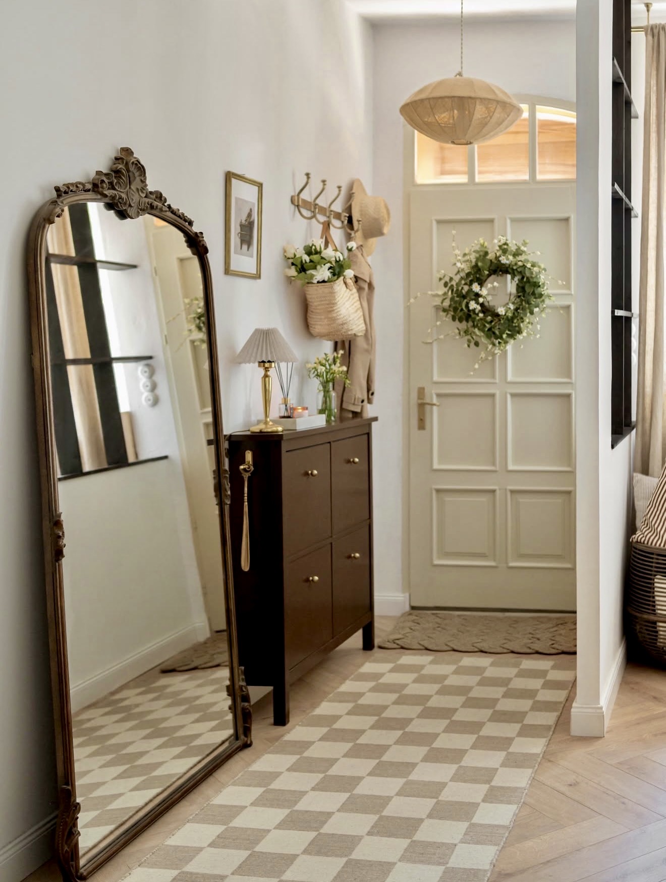 Charming Entryway with Vintage Mirror and Floral Wreath