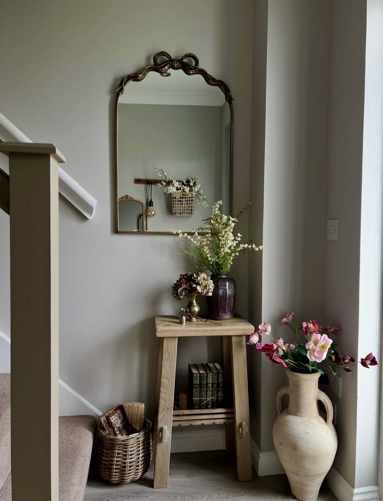 Charming Entryway With Vintage Mirror and Vases