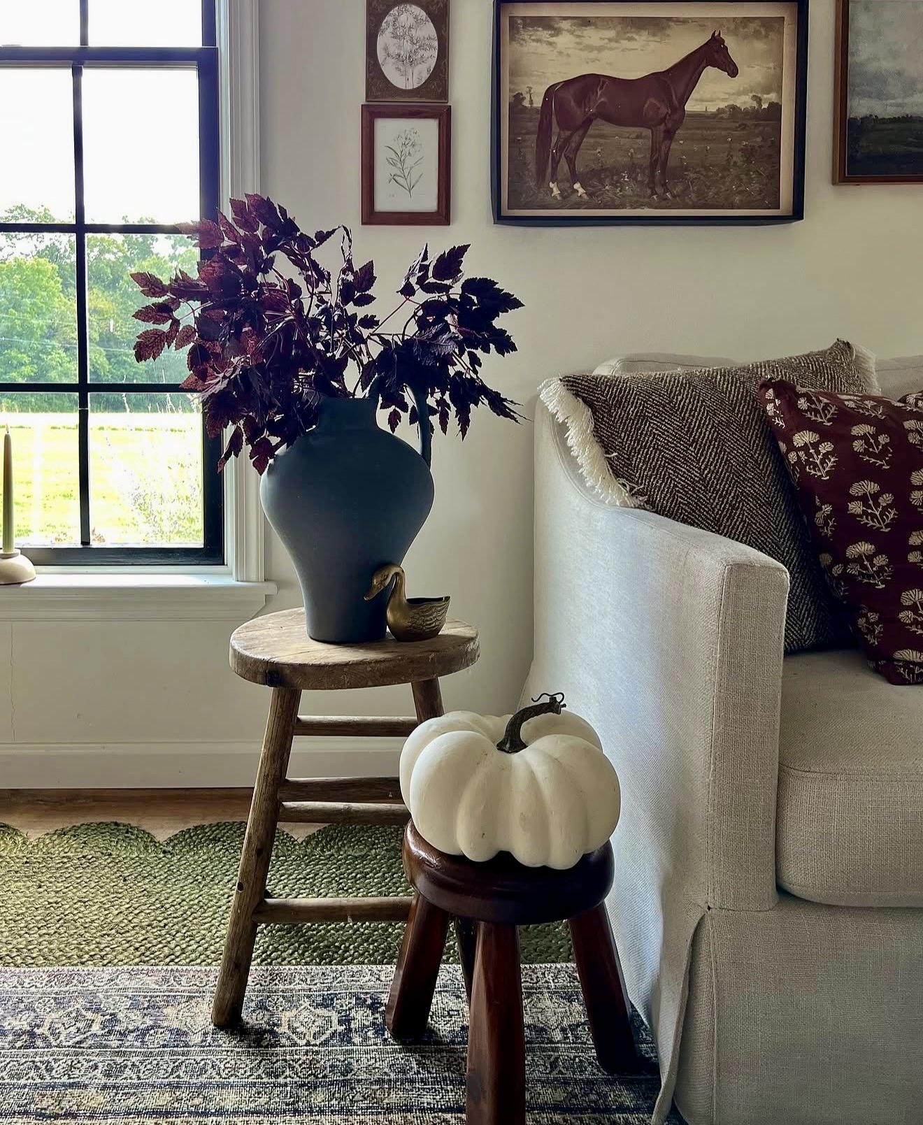 Cozy Fall Vignette With Pumpkins and Dark Florals