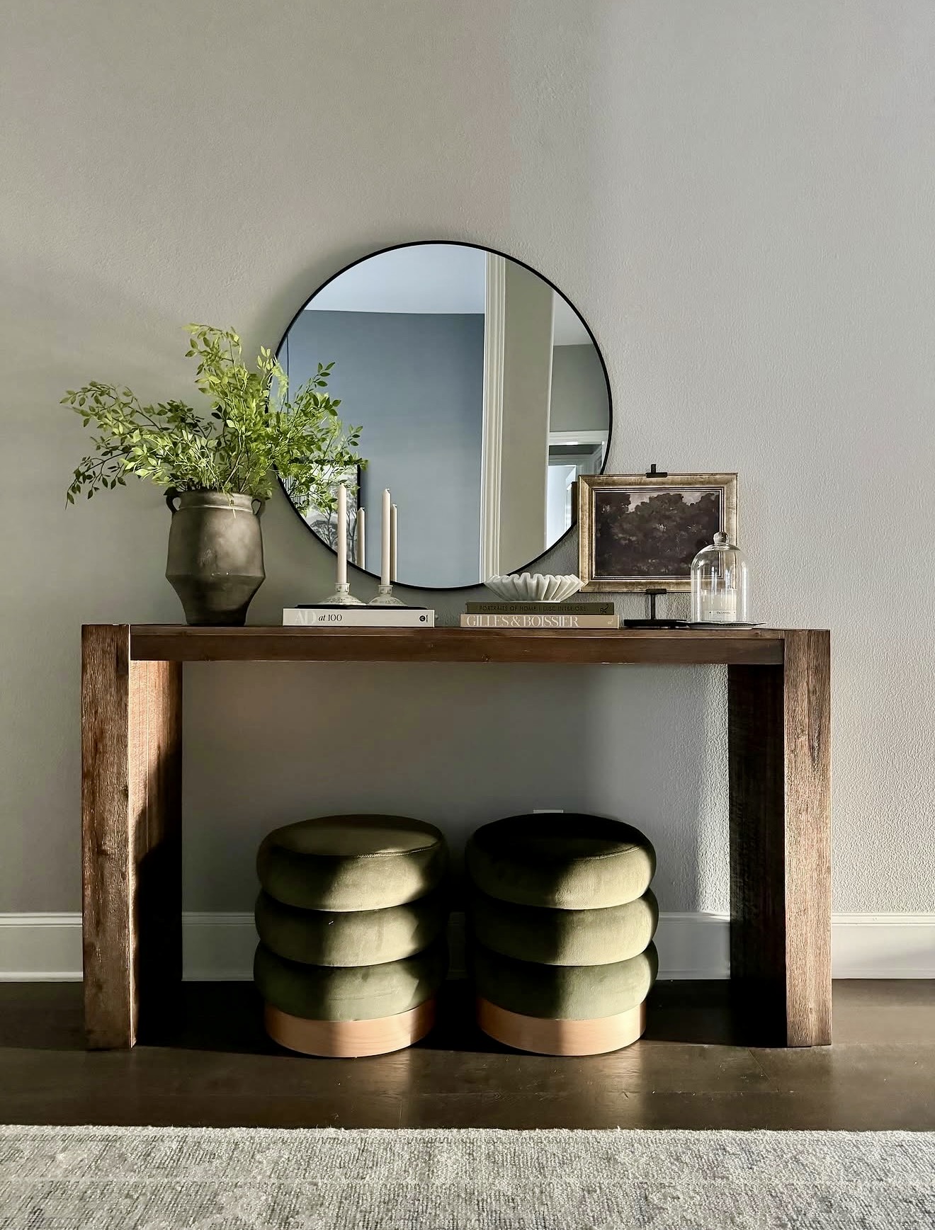 Cozy Velvet Ottomans Under a Rustic Console Table