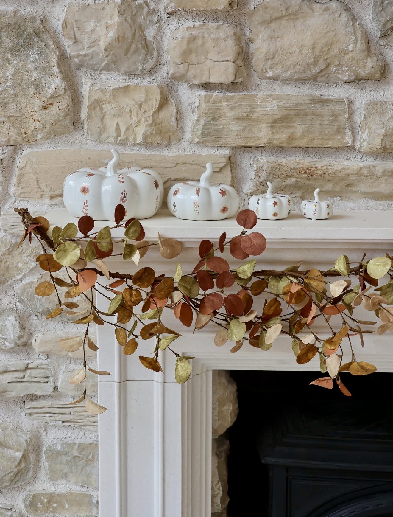 Elegant White Pumpkins on Rustic Stone Mantel