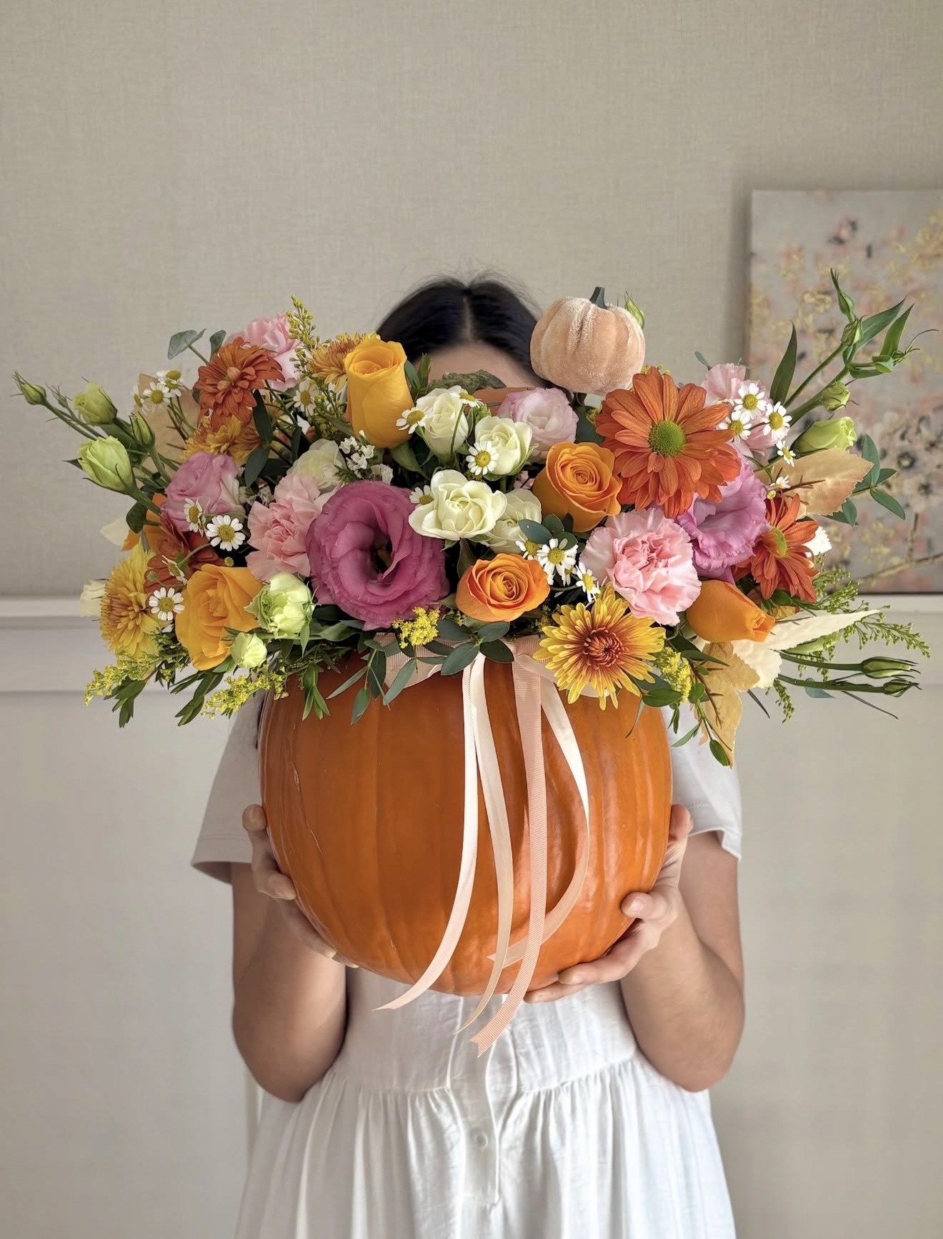 Pumpkin Vase Overflowing With Autumn Blooms