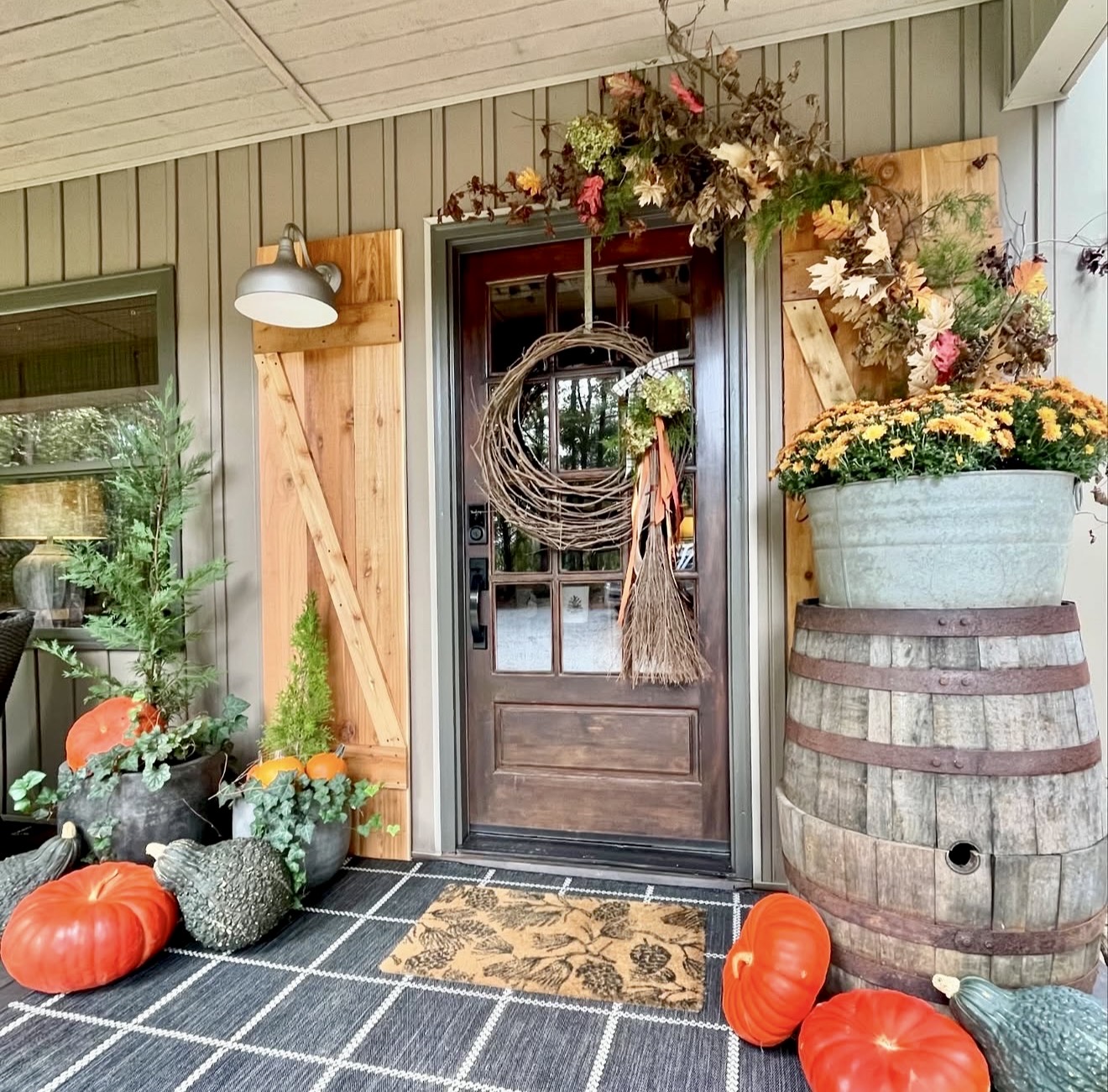 Rustic Fall Porch With Pumpkins and Mums