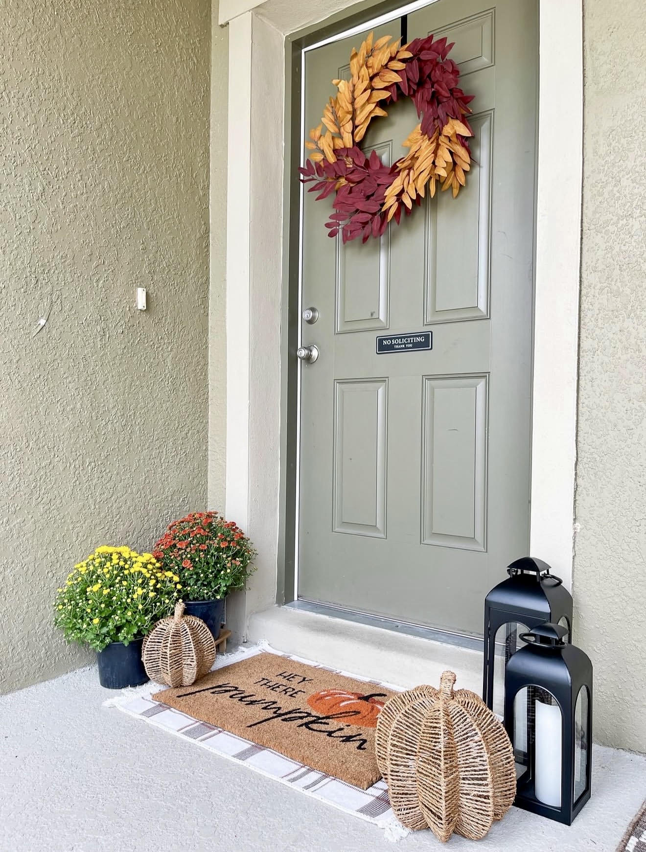 Welcoming Fall Front Porch With Pumpkins And Mums