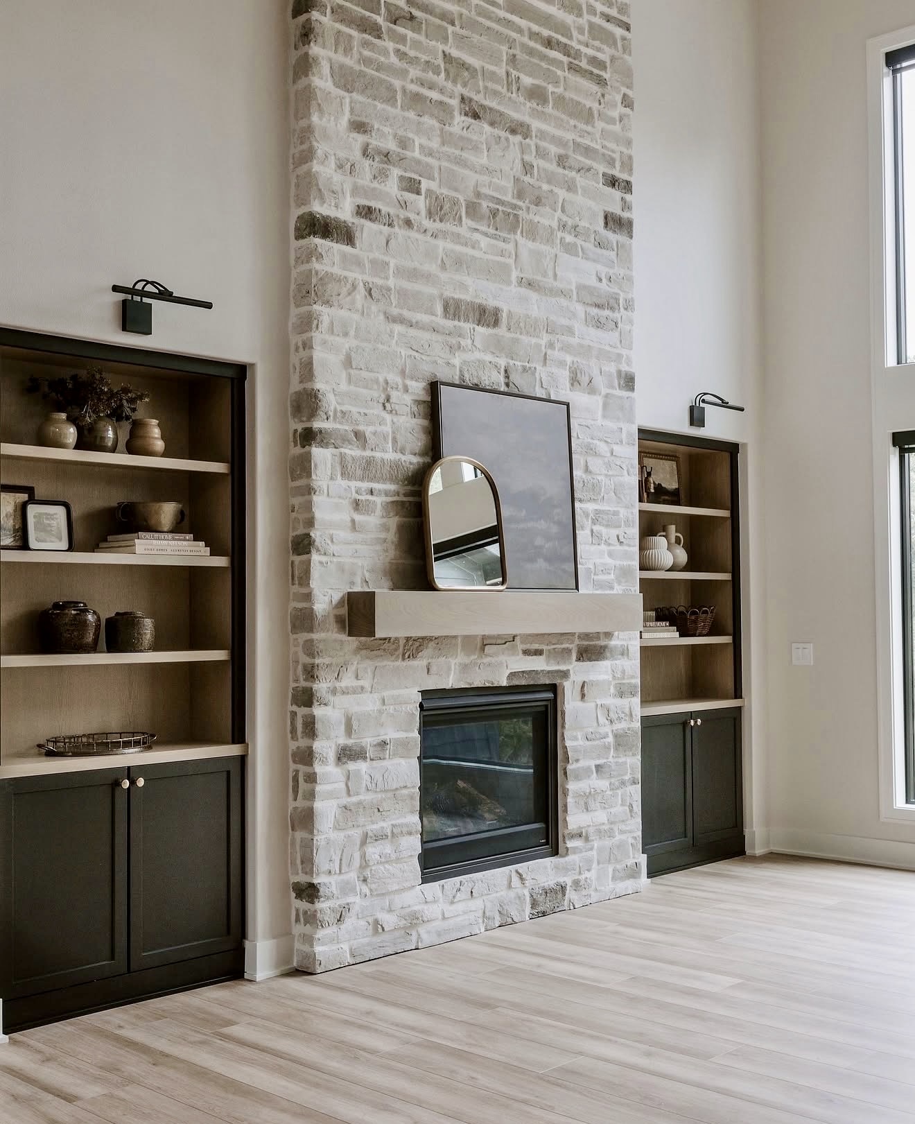 Chic Stone Fireplace With Floating Wood Mantel