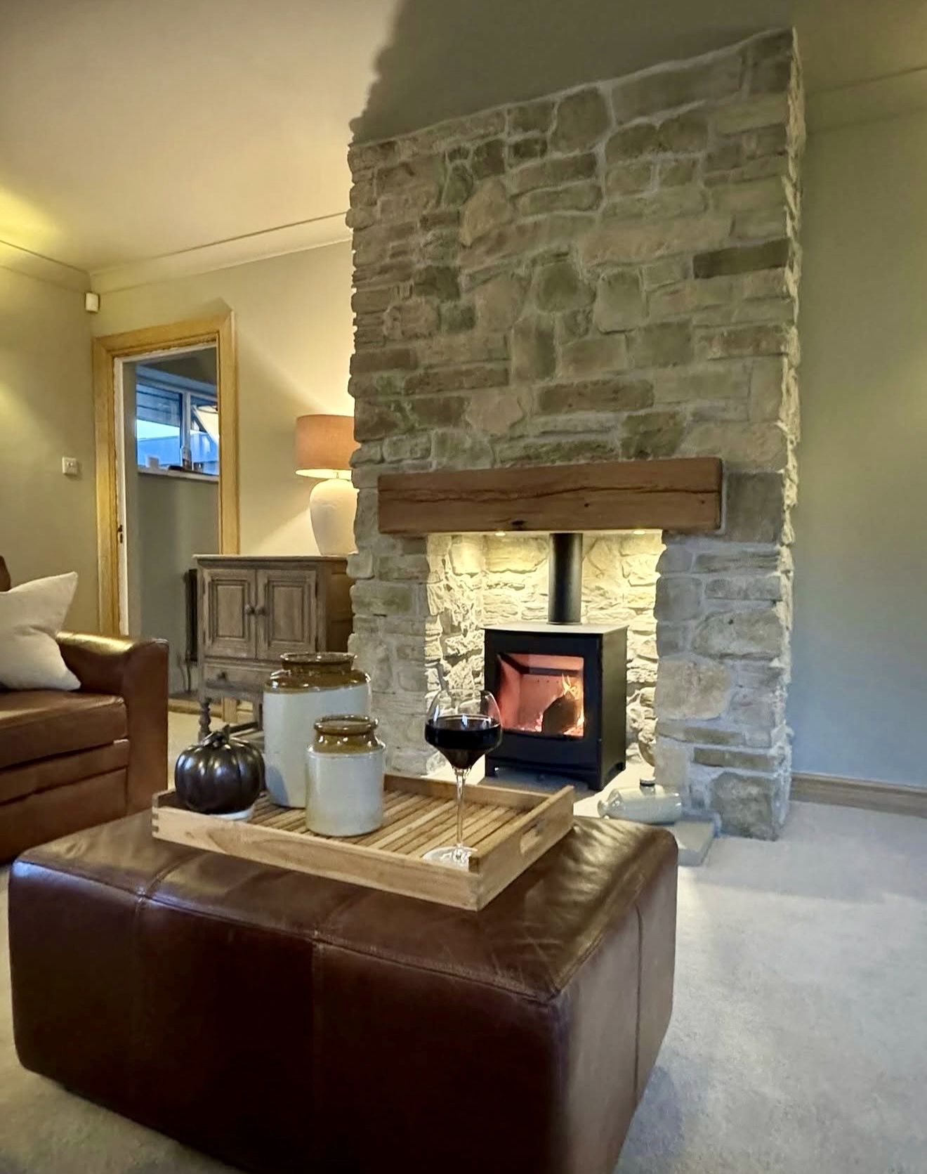 Cozy Stone Fireplace With Wood Mantel
