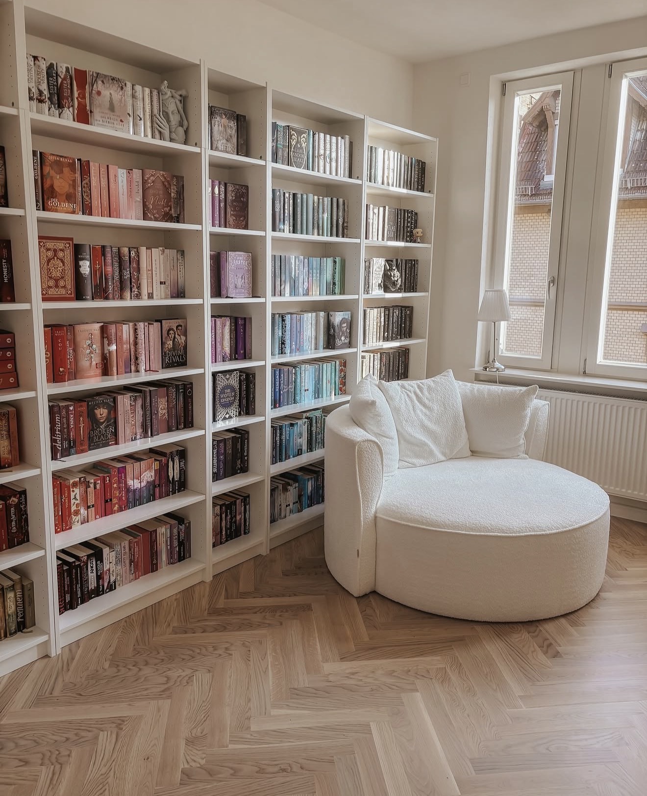 Cozy White Boucle Reading Chair By Wall of Books