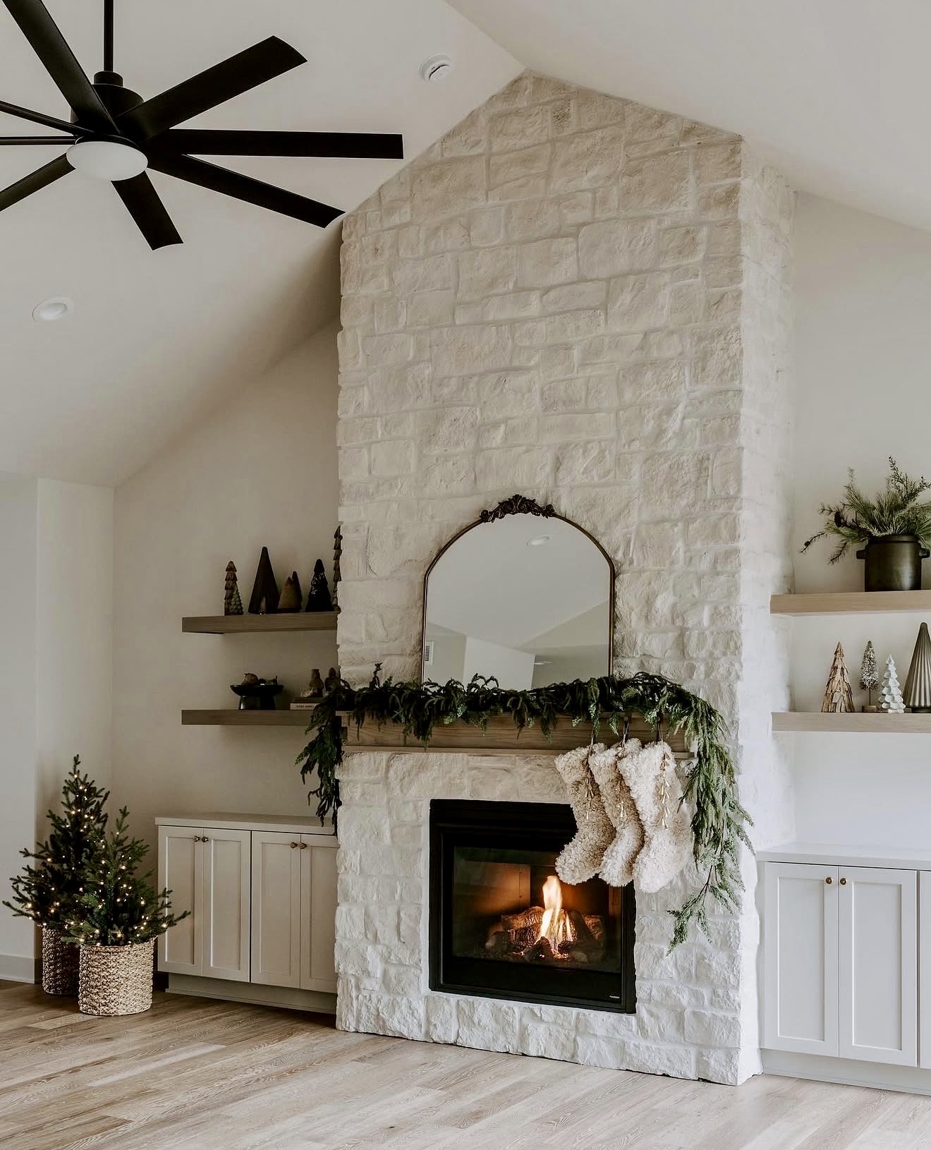 Cozy White Stone Fireplace with Natural Garlands