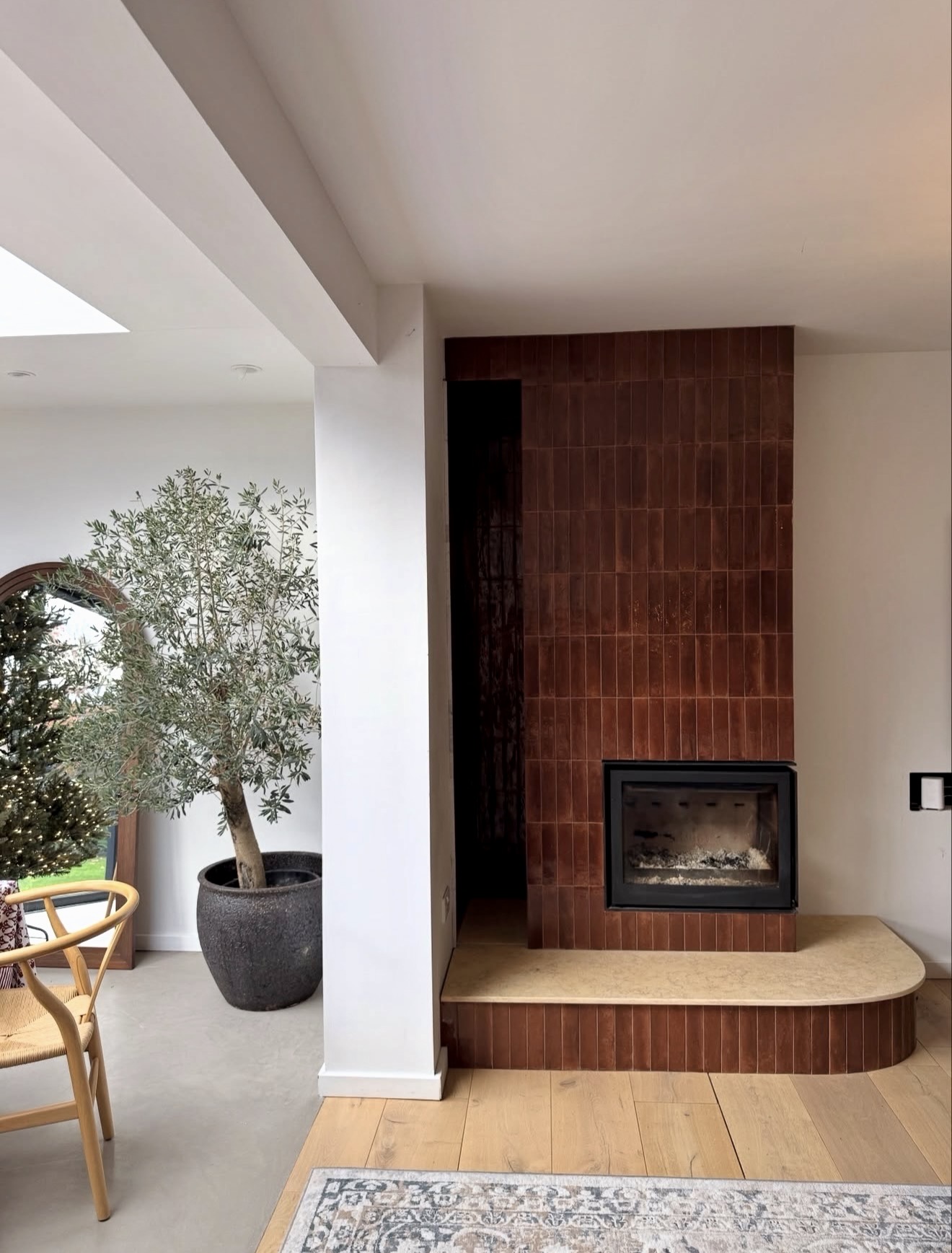 Dramatic Vertical Tile Fireplace Focal Point