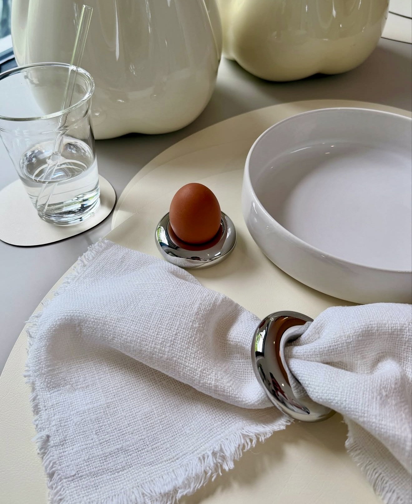 Minimalist Breakfast Table Setting With Chrome Accents
