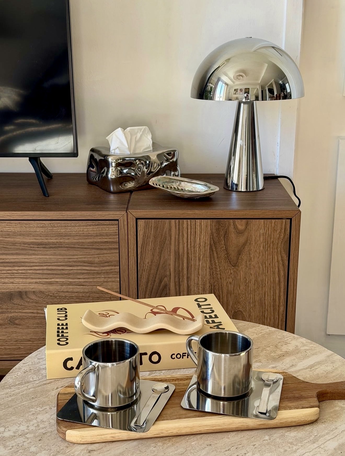 Modern Chrome Accents On Warm Walnut Wood