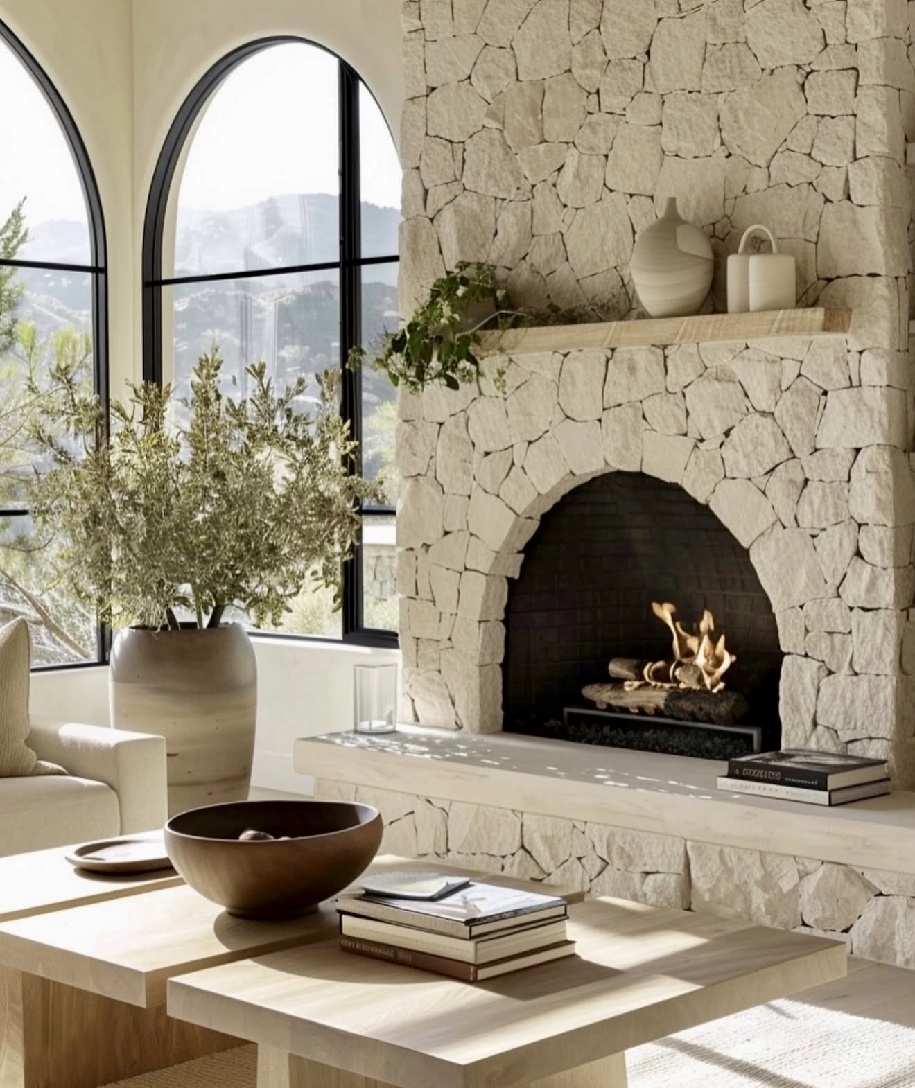Natural Stone Arched Fireplace with Modern Touches