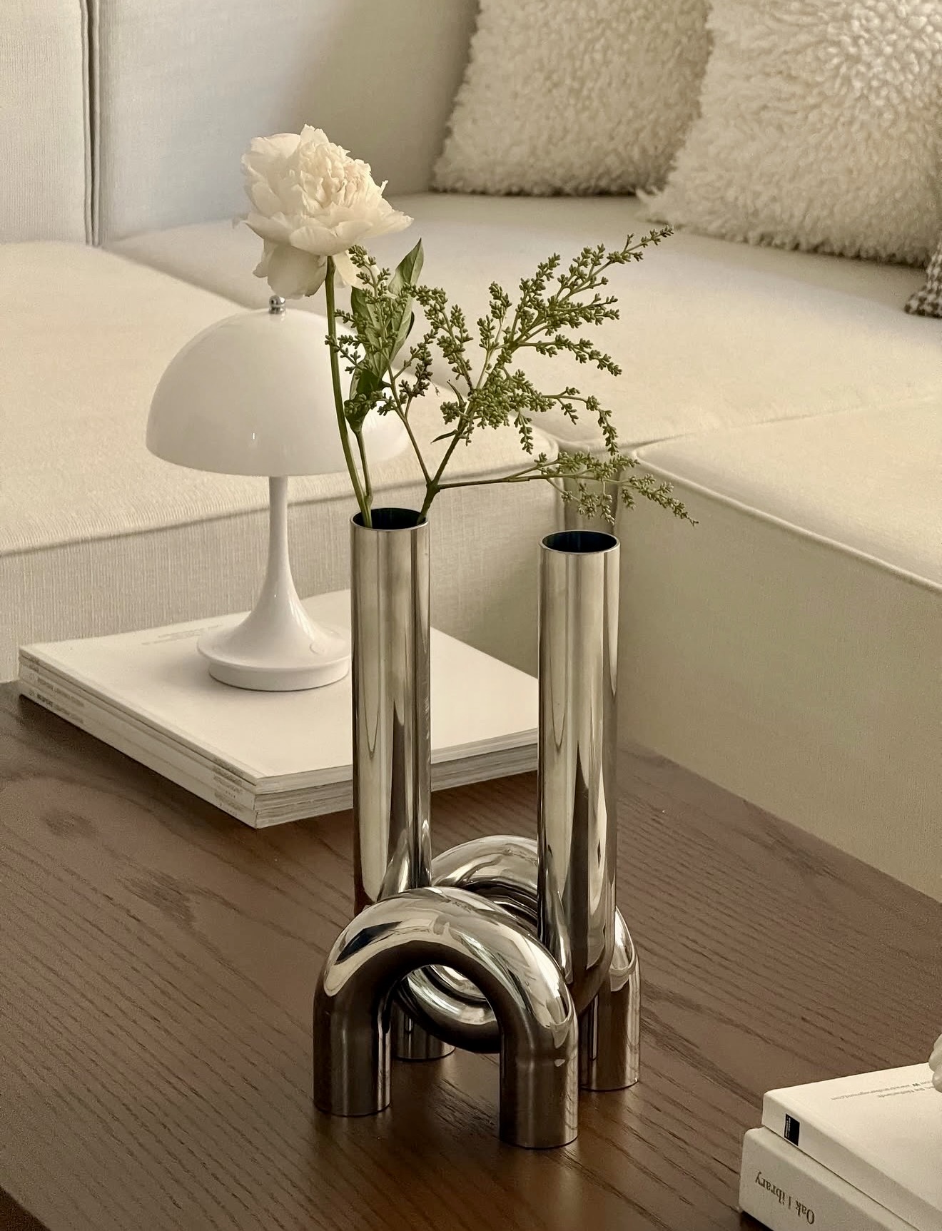 Polished Chrome Accents In Neutral Living Space