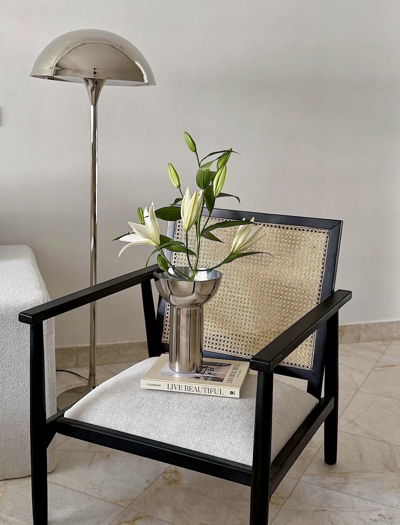 Sophisticated Cane Chair With Polished Chrome Accents
