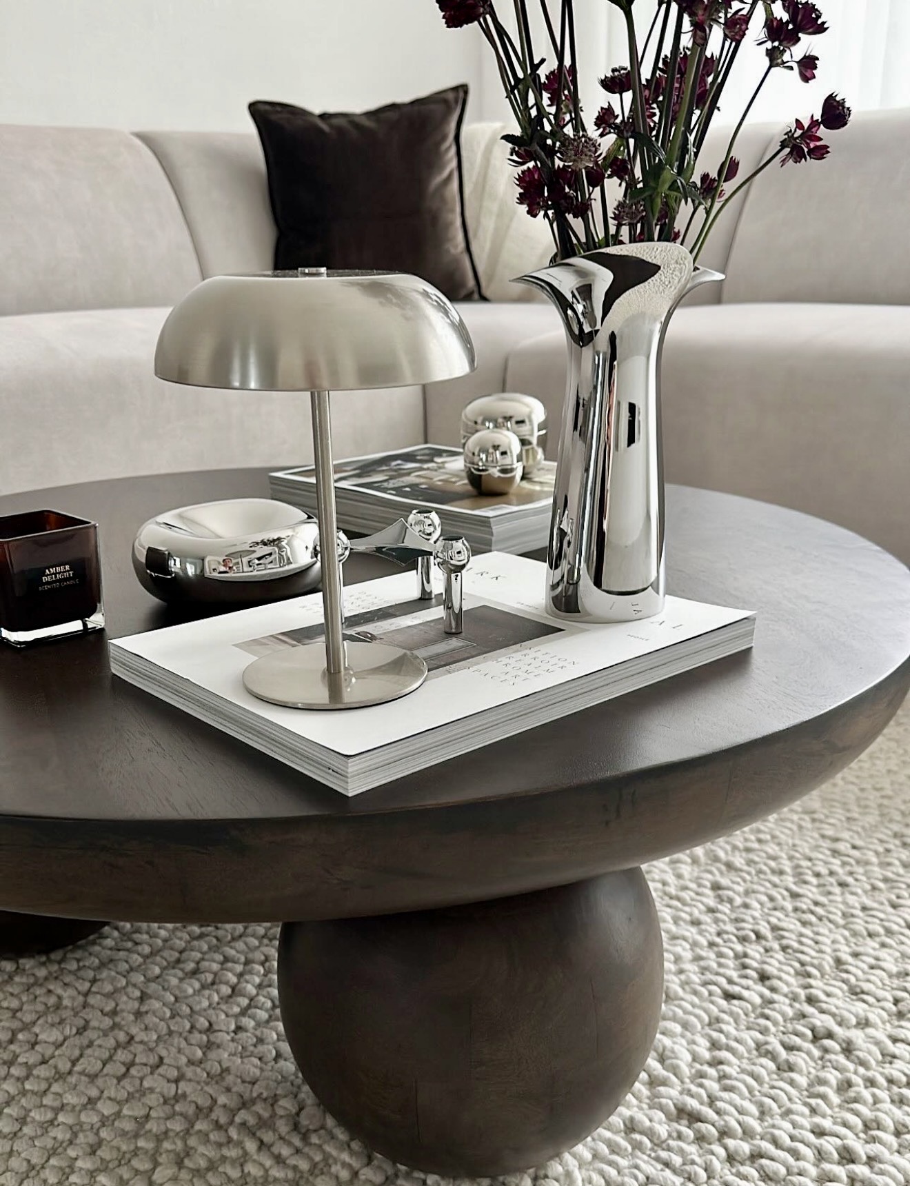Sophisticated Chrome Accents On Dark Wood Coffee Table
