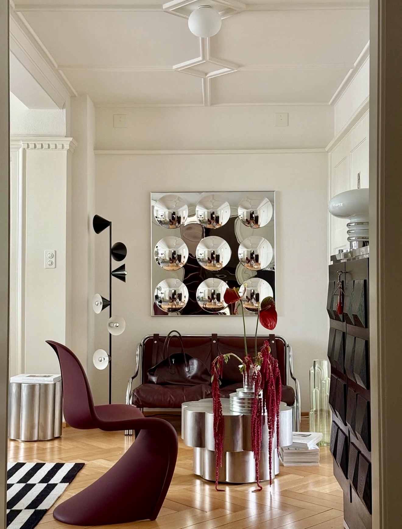 Sophisticated Living Room With Chrome Accents And Burgundy