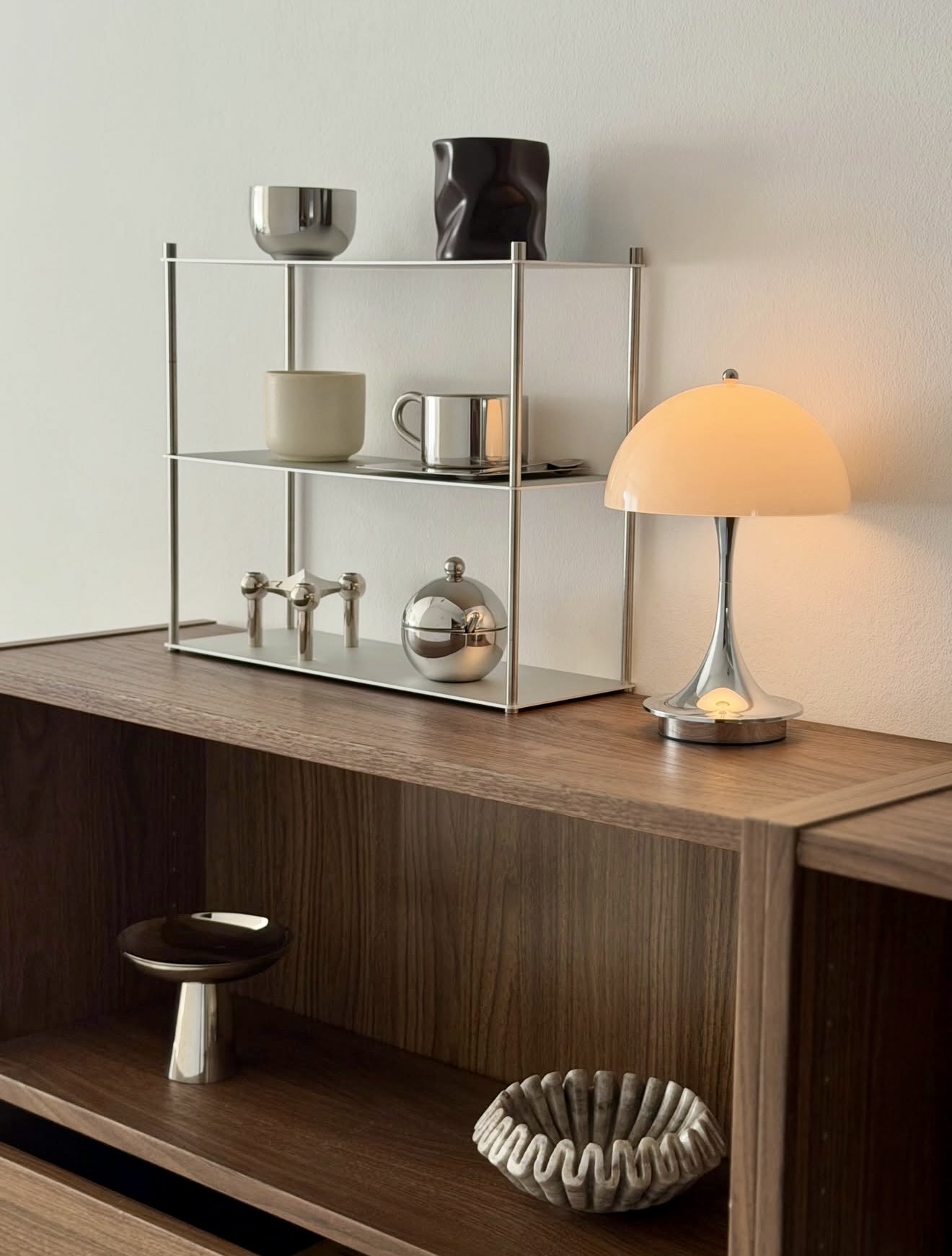 Sophisticated Walnut And Chrome Display Shelf Styling