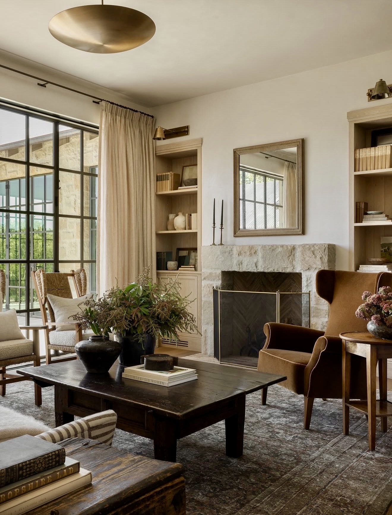 Textured Stone Fireplace With Warm Upholstery